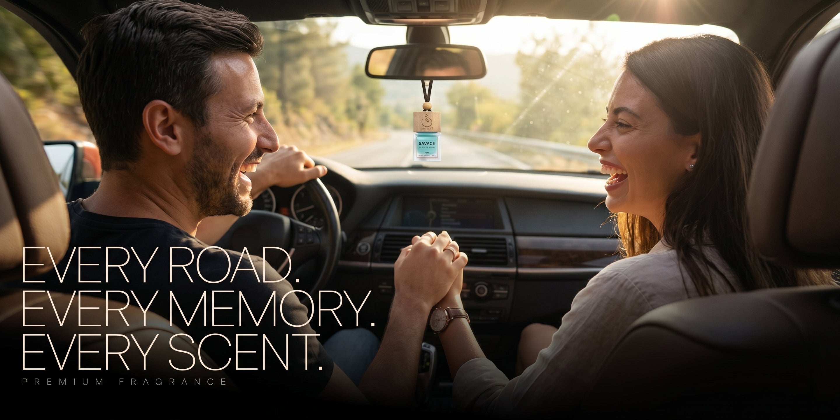 man and women in a luxury car with scense car air freshener in the background hanging form rear view mirror